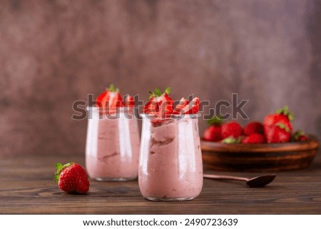 Similar – Image, Stock Photo Strawberry smoothie in a botle with pink background and pink paper straws.