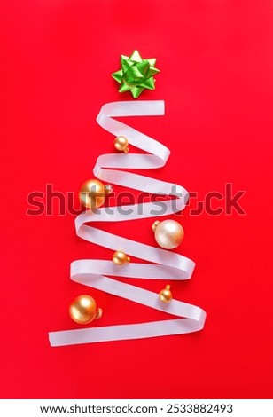 Similar – Image, Stock Photo Christmas tree decorations made of glass in the shape of a star hang in the Christmas tree. In the background you see blurredly even more tree decorations