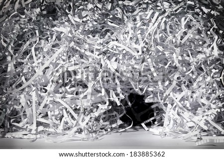 A small cave in a mountain side of shredded paper.