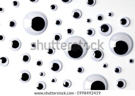 Similar – Image, Stock Photo Wobbly eyes that look at the word boo; Halloween, fear, fright