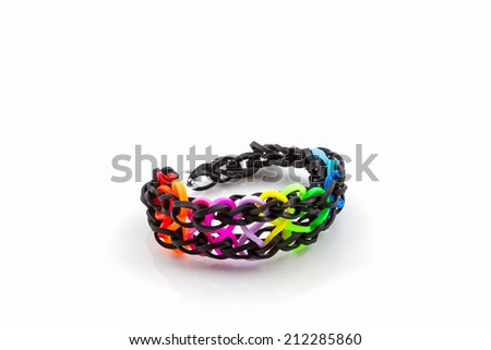 Colorful of elastic rainbow loom bands on white background.
