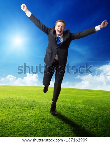 happy business man running on spring field