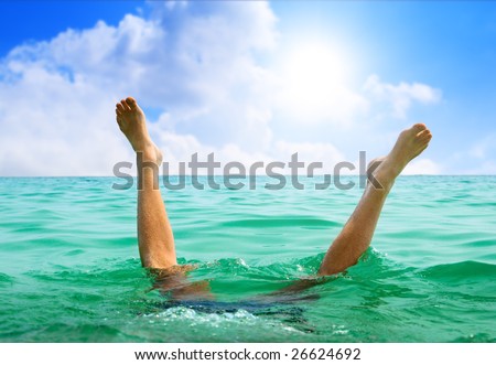 man jumping in ocean