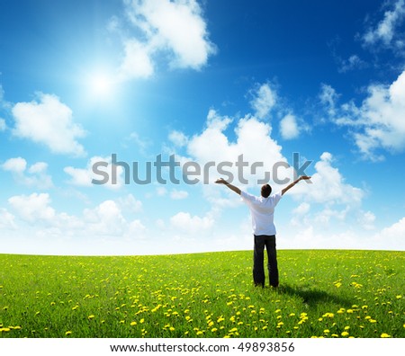 field of grass and happy young man