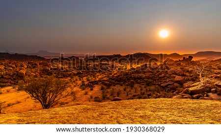 Similar – Image, Stock Photo Beautiful sunrise at Damaraland, Namibia. Group of people seen from their back walking up a mountain.