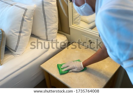 Deep cleaning for Covid-19 (corona virus) disease prevention. For safety, spray alcohol, disinfectant on the cleaning cloth wipes in places that are frequently touched at the hotel.