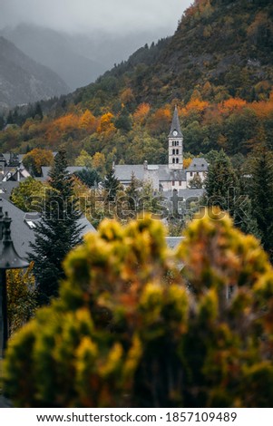 church of the town of Arties in the Aran Valley emerging among the trees during autumn Zdjęcia stock © 