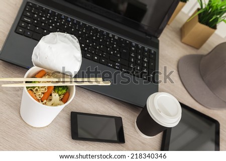 Lunch Box With Chinese Food And Work Equipment On Working Desk
