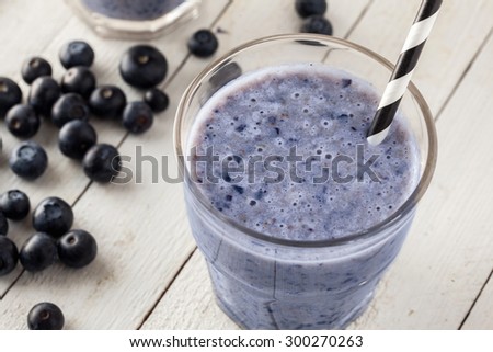 Fresh Blueberry Smoothie In Glass With Drinking Straw