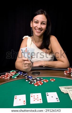 Attractive young caucasian woman wins with two ace in the casino