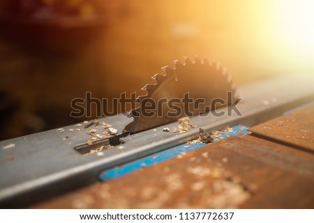 Similar – Image, Stock Photo Saws details of furniture with a circular saw. circular saw for cutting wood.