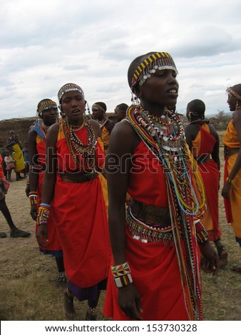 MASAI MARA, KENYA - JULY 16: Group of unidentified African women doing tribal dancing on July 16, 2010 in Masai Mara, Kenya. Maasai are a Nilotic ethnic group of semi-nomadic people located in Kenya.