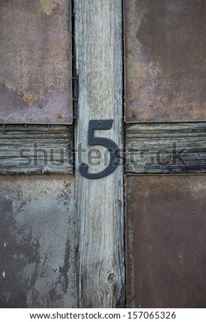 photos of house numbers, numbers of doors, fences rooms, rooms gables of houses in a small town near Barcelona, Spain.