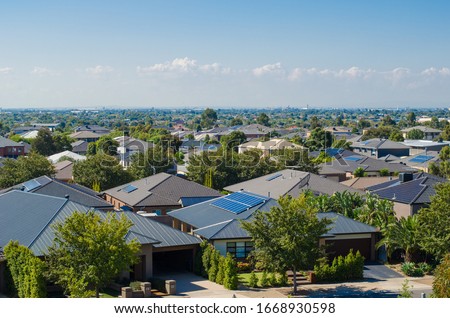 Aerial view of residential houses in Melbourne's suburb. Elevated view of Australian homes against blue sky. Copy space for text. Point Cook, VIC Australia. Stock foto © 