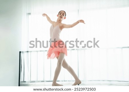 Similar – Foto Bild Ballerina-Tänzerin beim Aufwärmen des flexiblen Körpers im sonnigen Studio.