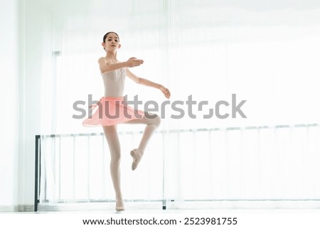 Similar – Foto Bild Ballerina-Tänzerin beim Aufwärmen des flexiblen Körpers im sonnigen Studio.