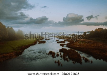 Similar – Image, Stock Photo calm water in Latvian winter / river near my house / the day when ice forming on water / sunrise over land