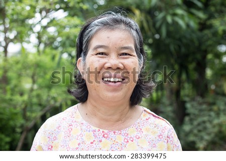 beautiful smiling woman with wrinkles,asian old woman,thailand