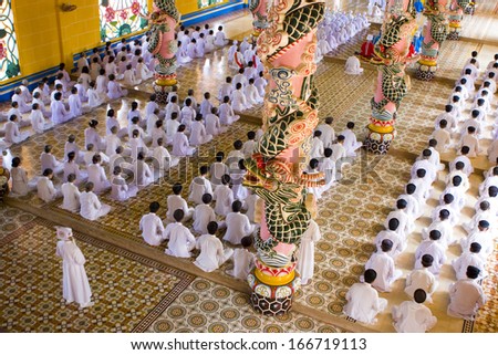 18 NOVEMBER 2011 - TAY NINH, VIETNAM - Congregation at the Cao Dai Holy See, main church, on 18 November 2011, near Ho Chi Minh City, Vietnam