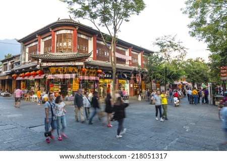 16 SEPTEMBER 2014 - DALI, CHINA - People walk the streets of the old town of Dali, Yunnan