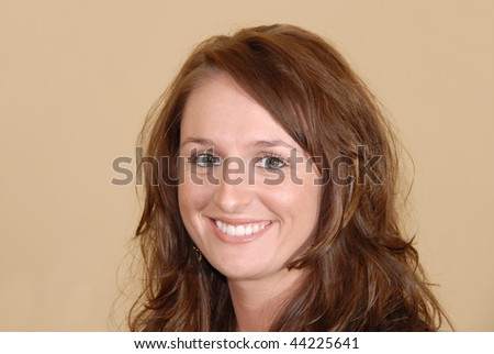 Young female woman model smiling at camera framed off center..