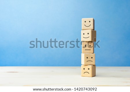Wooden blocks with the happy face smile face symbol symbol on the table, evaluation, Increase rating, Customer experience, satisfaction and best excellent services rating concept with copy space Stockfoto © 