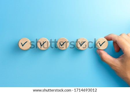 Checklist concept, Check mark on wooden blocks, blue background with copy space Photo stock © 