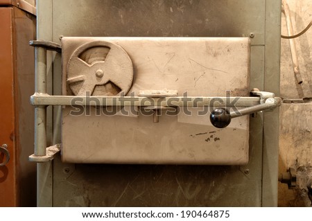 Old oven\'s door in old boiler room