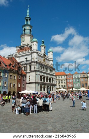 Poznan, Poland - July 13, 2014: Unidentified people at town hall on marketplace in Poznan, Poland