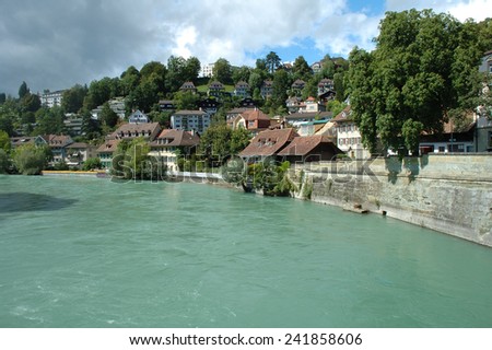 Bern, Switzerland - August 15, 2014: Buildings and trees at Aare river in Bern, Switzerland.