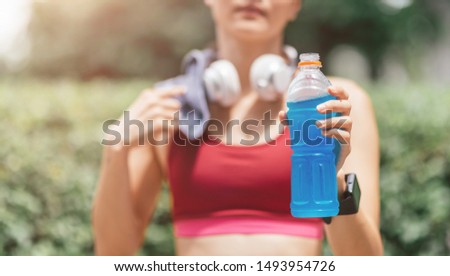 Similar – Image, Stock Photo Woman drinking isotonic drink while resting