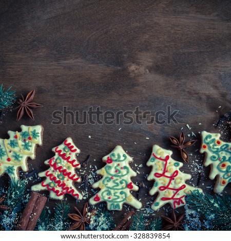 Christmas cookies in the shape of a Christmas tree on a dark wooden background. Retro style