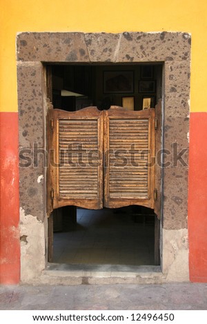 View on a typical urban scene with colorful folding door in old saloon. Guadalajara. Mexico