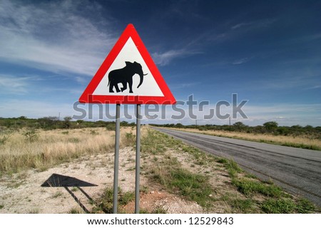 Caution: Elephants! Road sign standing beside road. Namibia. Africa