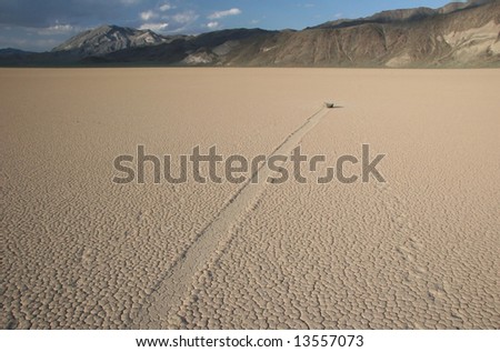 Famous natural phenomena moving stone in the desert of Death Valley national park. California. USA