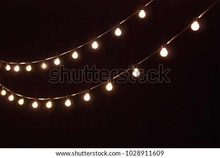 Similar – Image, Stock Photo Christmas bulb lights hanging on the street for decoration.