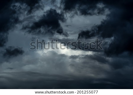 Rare beams of sun shine dense beautiful clouds during bad weather