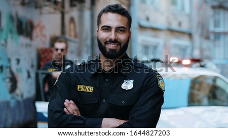 Similar – Image, Stock Photo Professional policemen in protective gear during dangerous operation