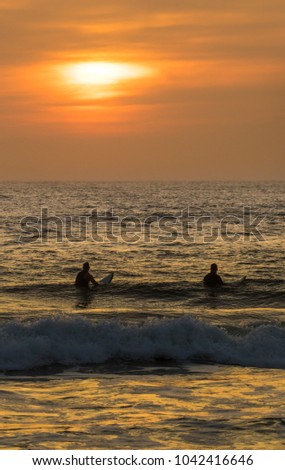 Sunrise Over The Atlantic Ocean At St Augustine Beach In Florida Two Surfer Wait For Sunrise Over The Atlantic Ocean At St Augustine Beach In Florida Two Surfer Wait For