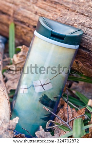 Cute tumbler cup (Thermo cup) for picnic tea in the forest