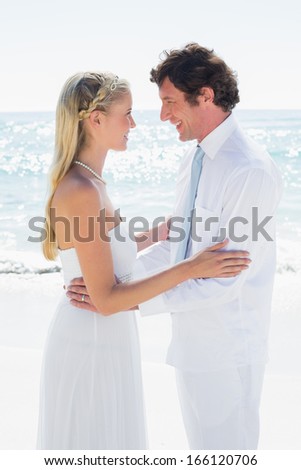 Romantic happy couple on their wedding day  at the beach