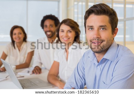 Group portrait of business people in a meeting at the office