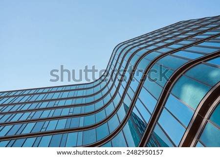 Similar – Image, Stock Photo Facade of a high-rise building with white wall, many small windows and balconies on the side in front of a blue sky