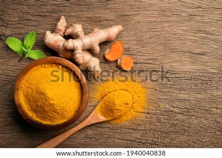 Similar – Image, Stock Photo Turmeric roots and powder in a white bowl on a grey wooden table. Close up. Spice.