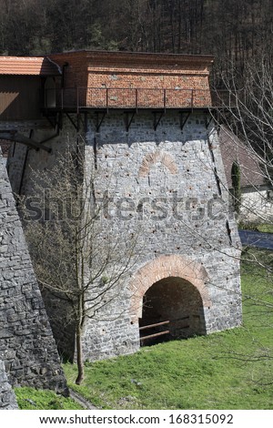 Old blast furnace for smelting iron, built in the 18th century, near Adamov, Czech Republic. The monument area of the state technical reservation with a charcoal furnace which is 10 metres high.