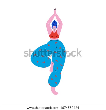 Happy plus size girl standing in tree pose yoga position.Beauty concept.Beautiful woman after a bath with a towel on the head puts patches under the eyes and does the morning ritual practices yoga