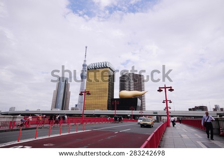 TOKYO, JAPAN - May 27, 2015: Tokyo Skytree and Asahi Beer Hall along the Sumida River on May 27, 2015 in Tokyo, Japan.