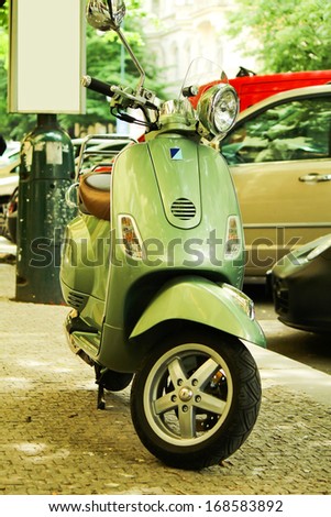 PRAGUE, CZECH REPUBLIC - MAY 18: Green scooter Vespa parked at the street on May 18, 2012 in Prague, Czech Republic. Vespa is a most popular Italian model in Europe