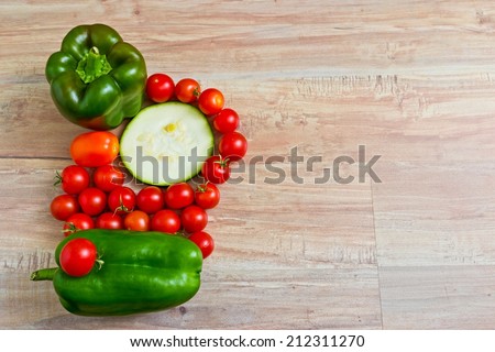 Fresh vegetables at wooden background. Horizontal image. Objects at the left part