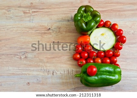 Fresh vegetables at wooden background. Horizontal image. Objects at the right part
